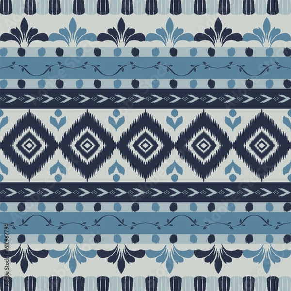 Fototapeta Seamless indigo ikat patterns in ethnic tribal style, featuring geometric diamond shapes and woven texture in blue tones.