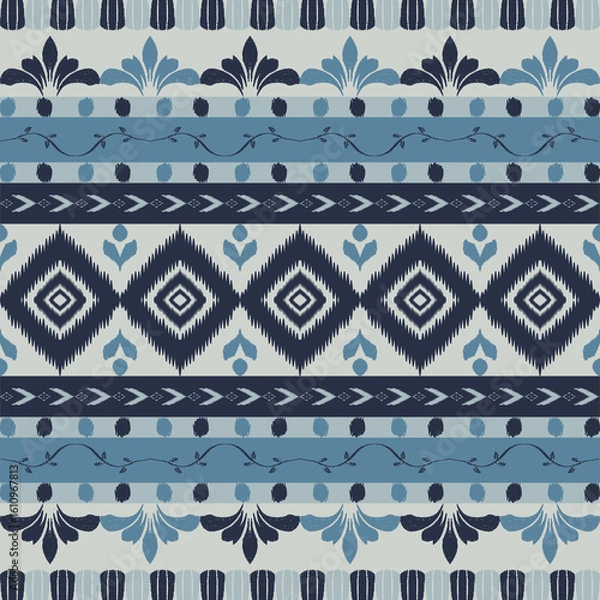Fototapeta Seamless indigo ikat patterns in ethnic tribal style, featuring geometric diamond shapes and woven texture in blue tones.