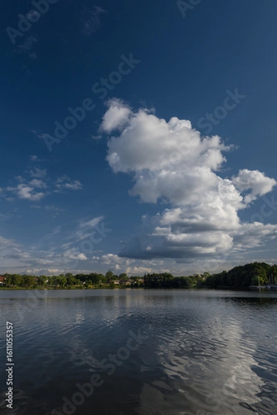Fototapeta SUMMERTIME IN THE CITY OF CZAPLIENK - Beautiful lake landscape with cumulus clouds against a blue sky