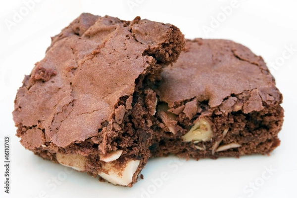 Obraz Two chocolate brownies stacked together on white