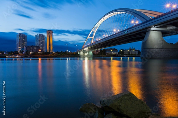 Fototapeta Apollo bridge and highrise buildings in Bratislava, Slovakia.