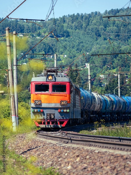 Obraz Freight train pulled by an electric locomotive on the Trans-Siberian Railway