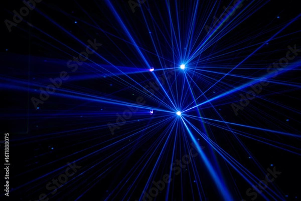 Fototapeta Blue beams in dark background.
