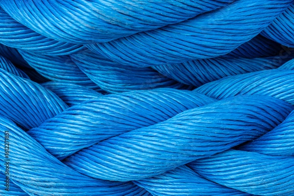 Fototapeta A nylon marine rope is shown in close-up as part of ship equipment. This material maritime