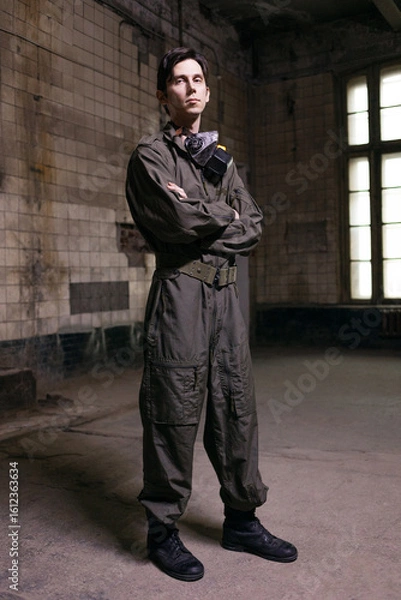 Obraz Battle-ready soldier in tactical gear with gas mask, intense grunge-style military portrait