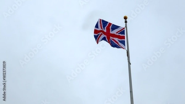 Obraz The flag of Great Britain flies over the beaches of Normandy.