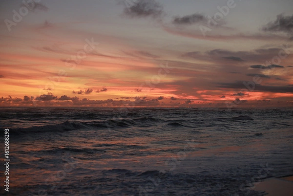 Obraz Orange Sunset with Soft Clouds over the Ocean