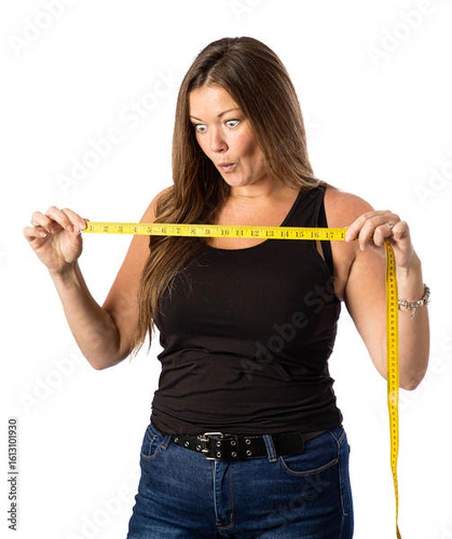 Fototapeta woman impress by measuring tape