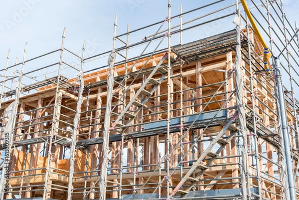 Obraz 木造住宅の建築現場　上棟作業中の一戸建て
