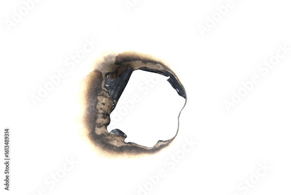 Obraz Realistic burned hole on transparent paper with scorched edges and smoke marks. Perfect for themes of fire, danger, damage, or aged effects in graphic design and digital projects.