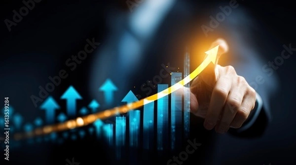 Fototapeta Businessman pointing at a glowing upward trending graph symbolizing financial growth