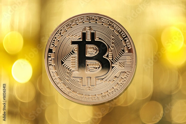 Obraz Golden bitcoin isolated on blurred light background
