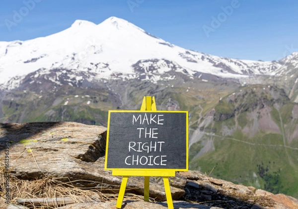 Fototapeta Make the right choice symbol. Concept words phrase Make the right choice on beautiful black blackboard. Beautiful mountain Elbrus background. Business Make the right choice concept. Copy space.