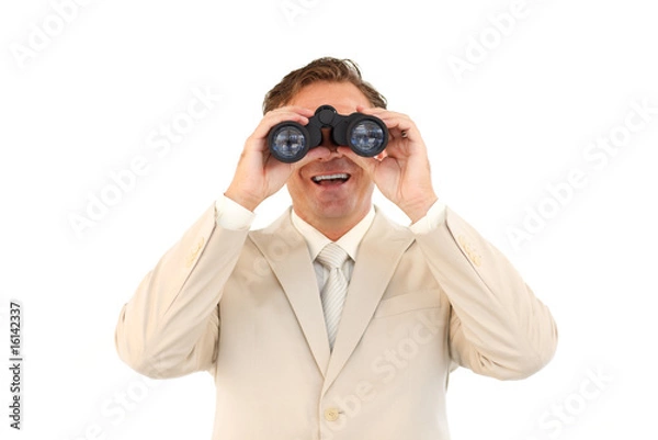 Obraz Smiling businessman looking through binoculars