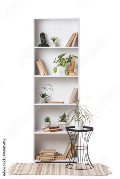 Fototapeta Shelving unit with coffee table, rug and decor on white background