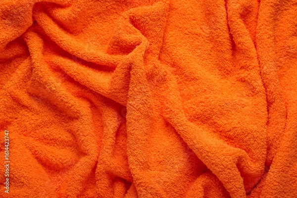 Fototapeta Texture of orange terry fabric as background, closeup