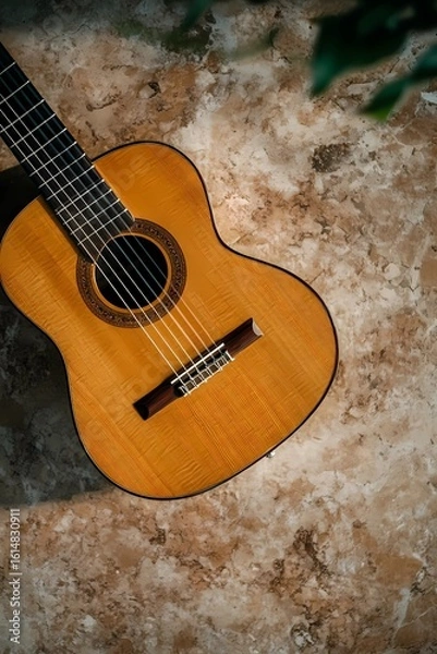 Fototapeta Still life of a guitar nestled on a cushioned seat, combining musical presence with a soft, calm setting.