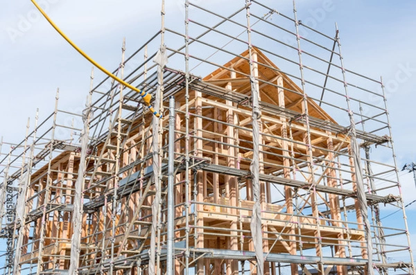 Obraz 木造住宅の建築現場　上棟作業中の一戸建て
