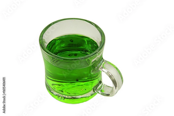Fototapeta a green glass mug with a handle on a white surface