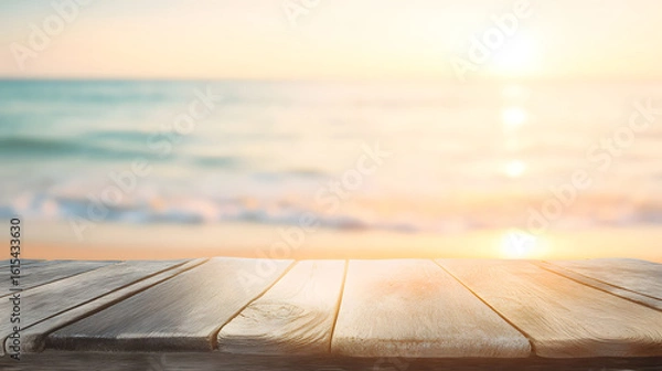 Obraz 
A sunlit wooden table by the beach with blurred ocean background