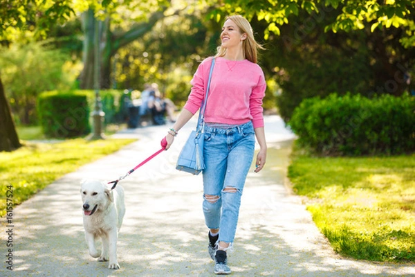 Fototapeta Woman enjoying park with dog