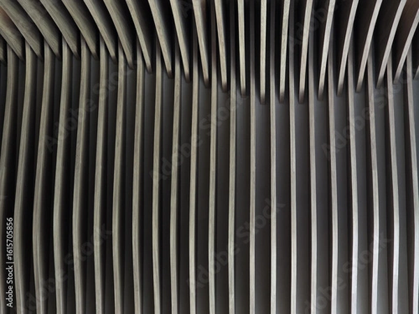 Obraz Modern architectural design features curved lines and layered patterns, creating visually striking effect. interplay of light and shadow enhances aesthetic appeal