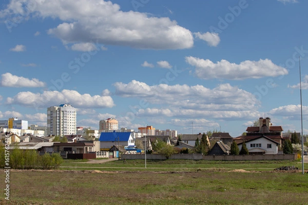 Obraz A small town under a bright blue sky, a beautiful city