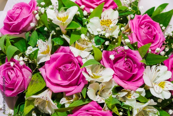 Obraz Beautiful bouquet of pink roses and white alstroemeria. Bunch of many colorful fragrant flowers. Floristry and floral design concept. Floral texture