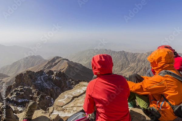 Fototapeta Toubkal national park, the peak whit 4,167m is the highest in the Atlas mountains and North Africa, trekkers relaxing and appreciating view.