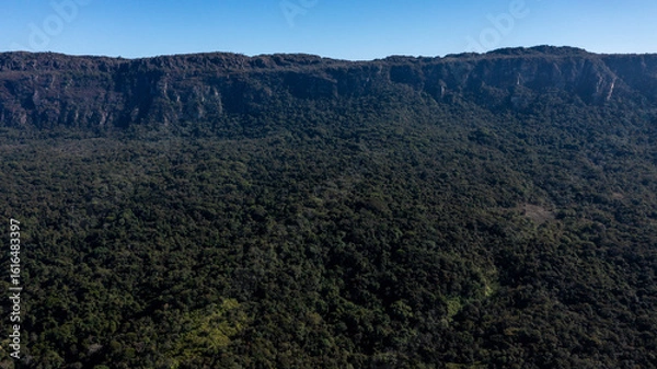 Fototapeta Aerial view of the São José mountain range, which borders the city of Tiradentes, in Minas Gerais, Brazil, on a beautiful dawn with clouds and blue sky.