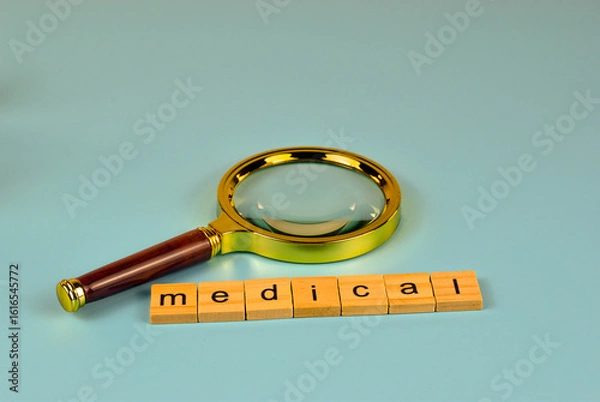 Fototapeta A magnifying glass examines the connection between income and insurance