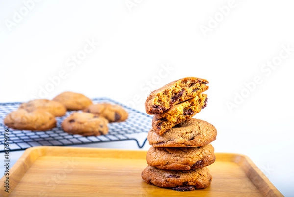 Fototapeta Stack of Dark Chocolate cookies isolated, American biscuits, cocoa confectionery cake, sweet morsels bakery, round pastry on white background