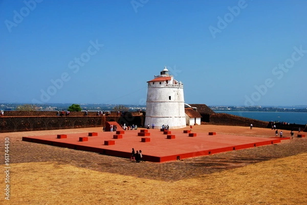 Obraz The lighthouse of the Aguada Fort in Candolim, Goa, India overlooking the Arabian Sea