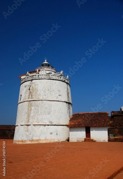 Obraz The lighthouse of the Aguada Fort in Candolim, Goa, India overlooking the Arabian Sea