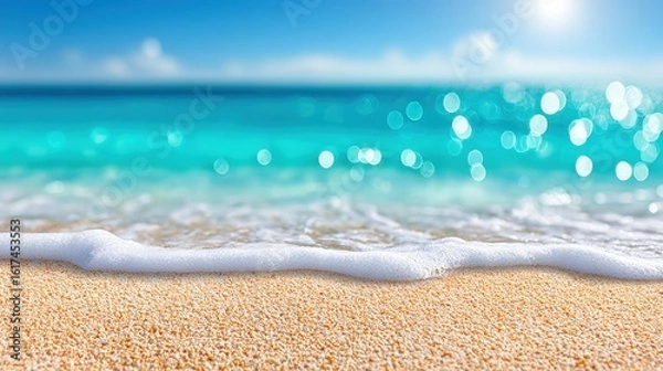 Fototapeta A close-up view of gentle ocean waves washing over a sandy beach under a bright, sunny sky.
