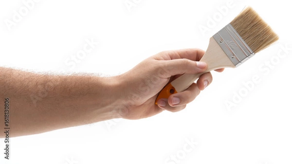 Obraz Hand holding a paintbrush ready for creative work
