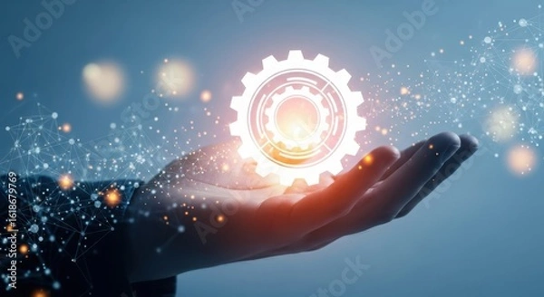 Fototapeta A glowing gear hovers above a hand, representing technological innovation and future progress