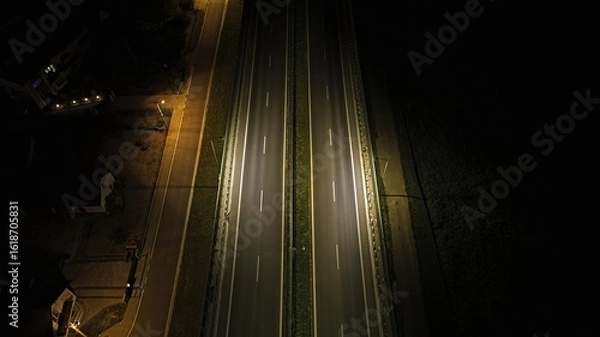 Obraz Aerial View of Empty Dual Carriageway Road at Night with Street Lights