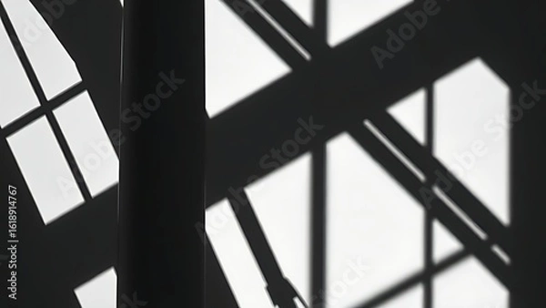 Obraz Geometric architectural shadows forming abstract monochrome patterns with high contrast.