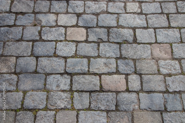 Fototapeta Cobblestone street, close up. Background/texture.
