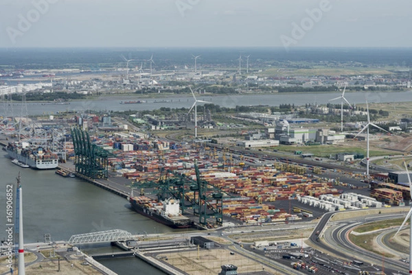 Fototapeta Aerial image of DP World Antwerp at deurganck dock terminal with container ship MSC Alyssa