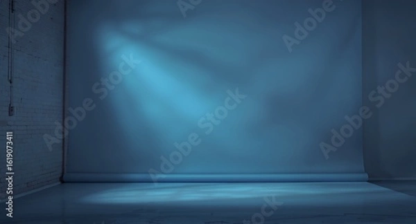 Fototapeta Empty Photo Studio Background with Blue Backdrop and Dramatic Lighting