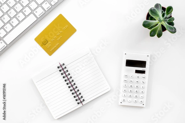 Fototapeta online purchasing with credit cards and notebook white manager desk background top view mock-up