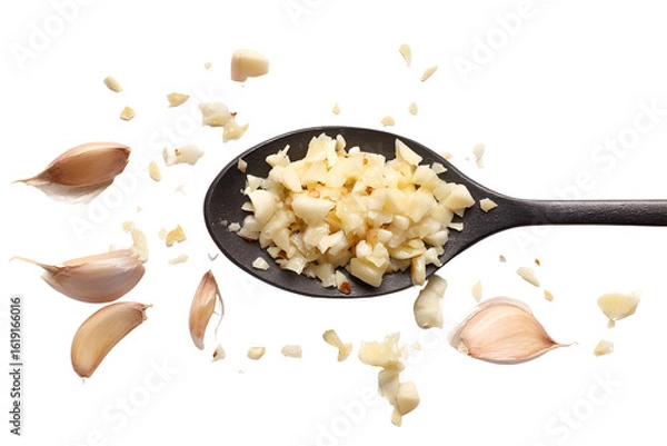 Obraz Minced Garlic in Black Spoon Cloves and Pieces