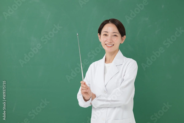 Fototapeta 指示棒を持つ白衣の女性