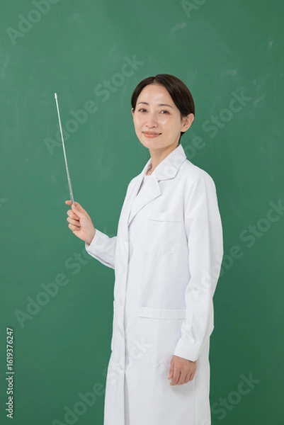 Fototapeta 指示棒を持つ白衣の女性