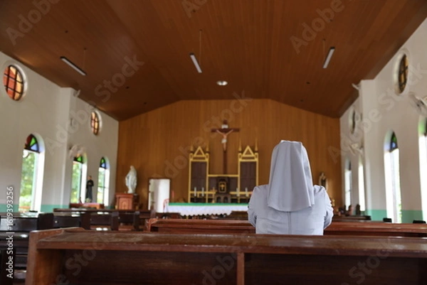 Fototapeta Landscape size picture of the interior of an empty roman catholic church
