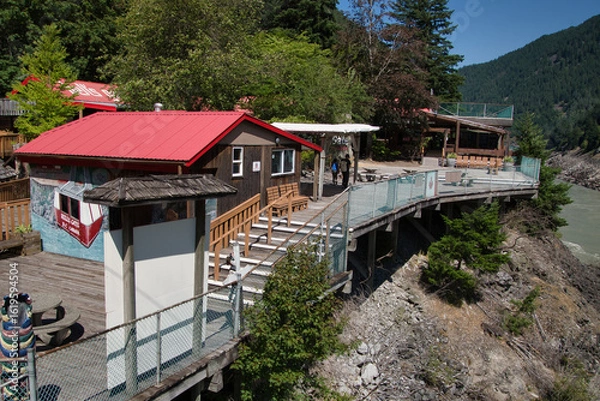 Fototapeta A view of the Hell's Gate facility in front of the muddy Fraser River.      BC Canada July 28th, 2025
