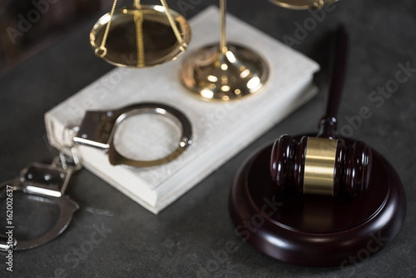 Fototapeta  Symbols of the law on a rustic desk