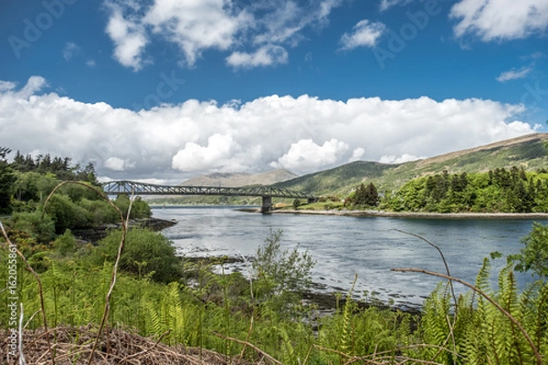 Fototapeta Loch Leven. The view across Loch Leven from Ballachulish towards Ballachulish Bridge in the Scottish highlands